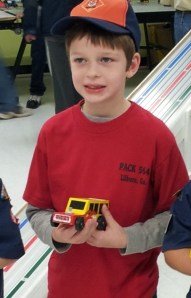 Harris posing for a photo for his second place design.