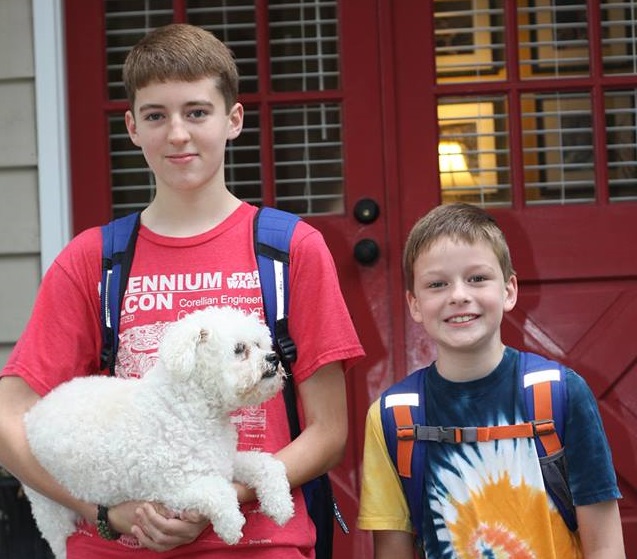 Boys with their dog on the first day of school
