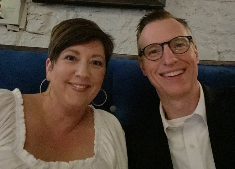 a woman and man in a restaurant booth