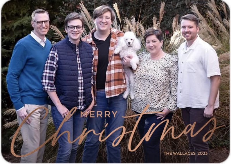 A husband and wife with three grown sons and their dog