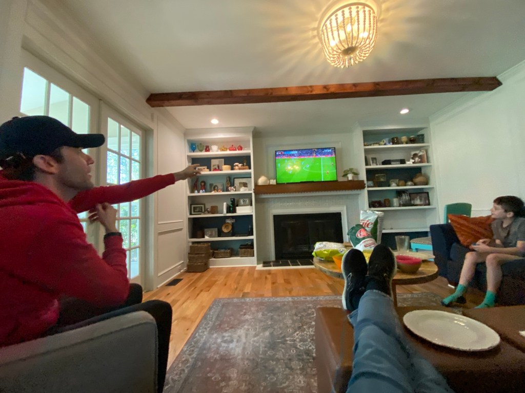 Men watching soccer on television