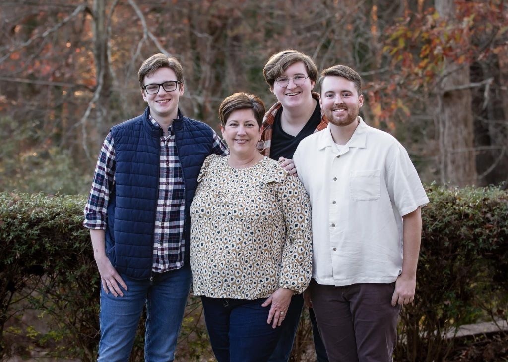 a woman and her three adult sons