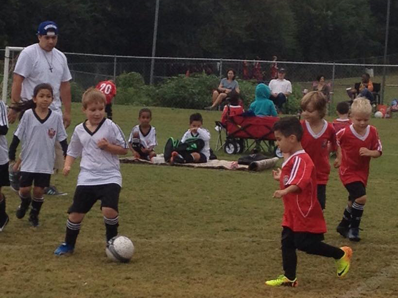 young children play soccer