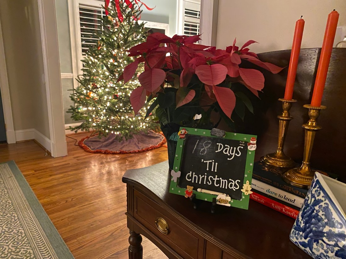 Christmas tree and chalkboard sign that reads "18 days 'til Christmas"