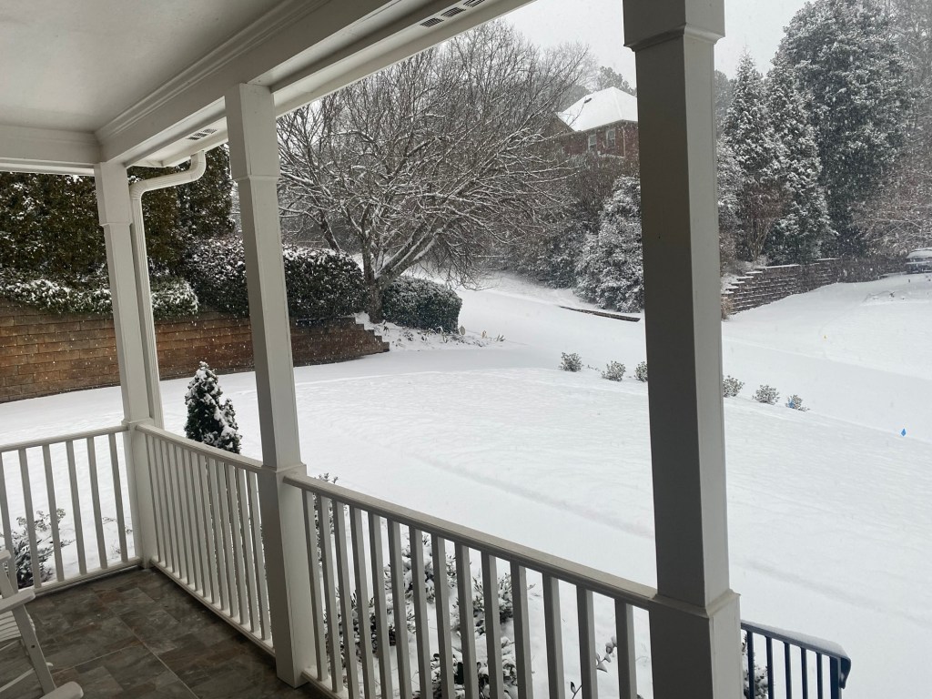 snow covered front lawn