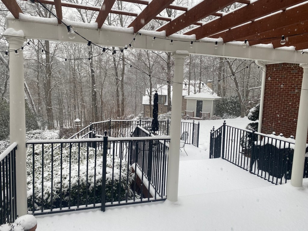 back deck and back yard covered in snow
