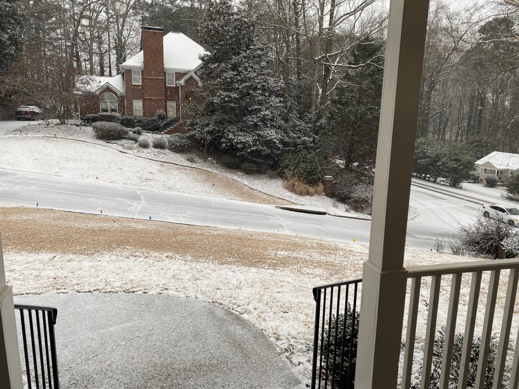 front yard with a light dusting of snow