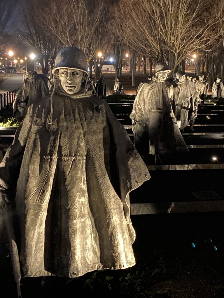 Bronze statues of soldiers in formation on patrol