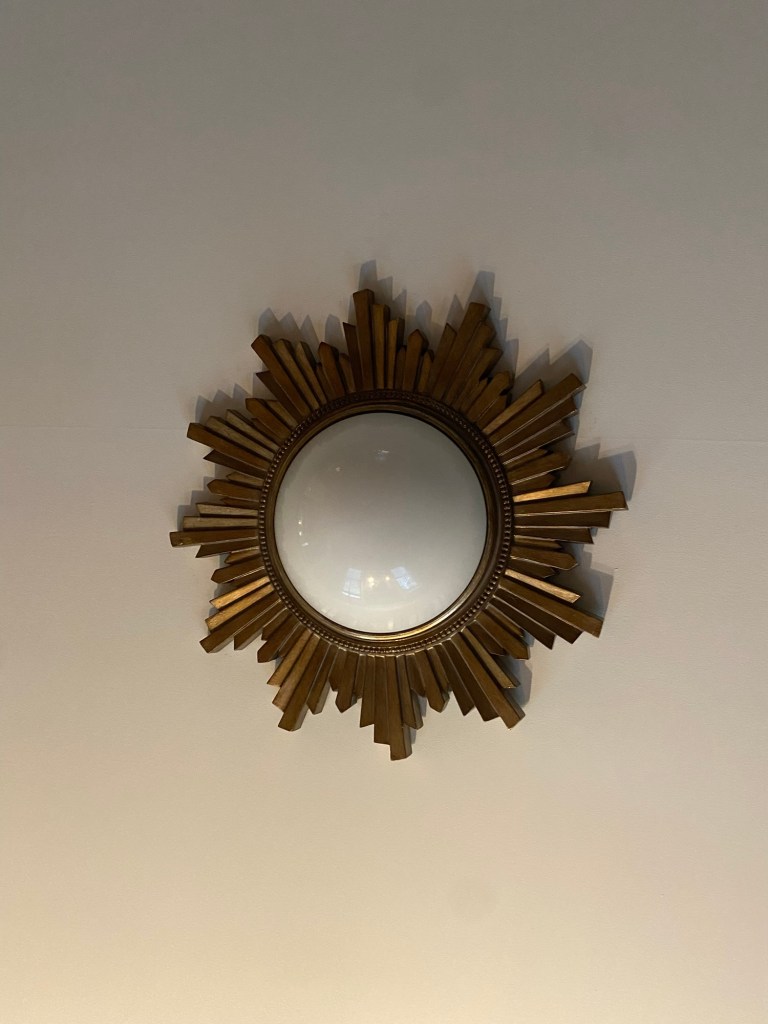 sun-like, ceiling-mounted light fixture