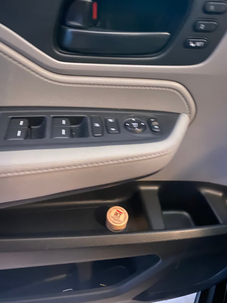 DCT lip balm in car door compartment