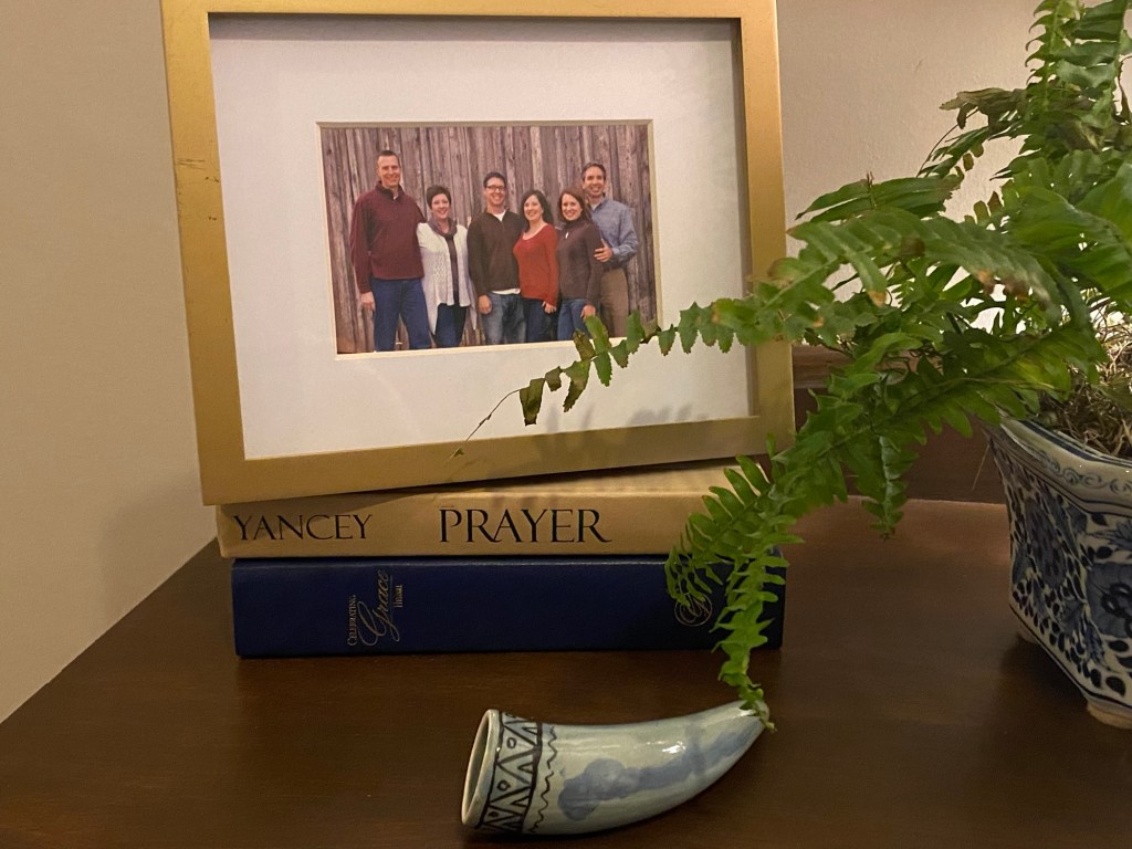 Picture frame perched on top of two books