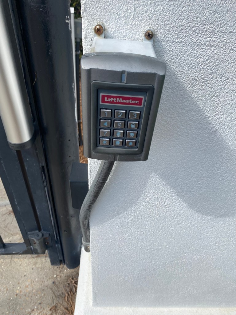 A code box on the pedestrian gate to get into the condo complex