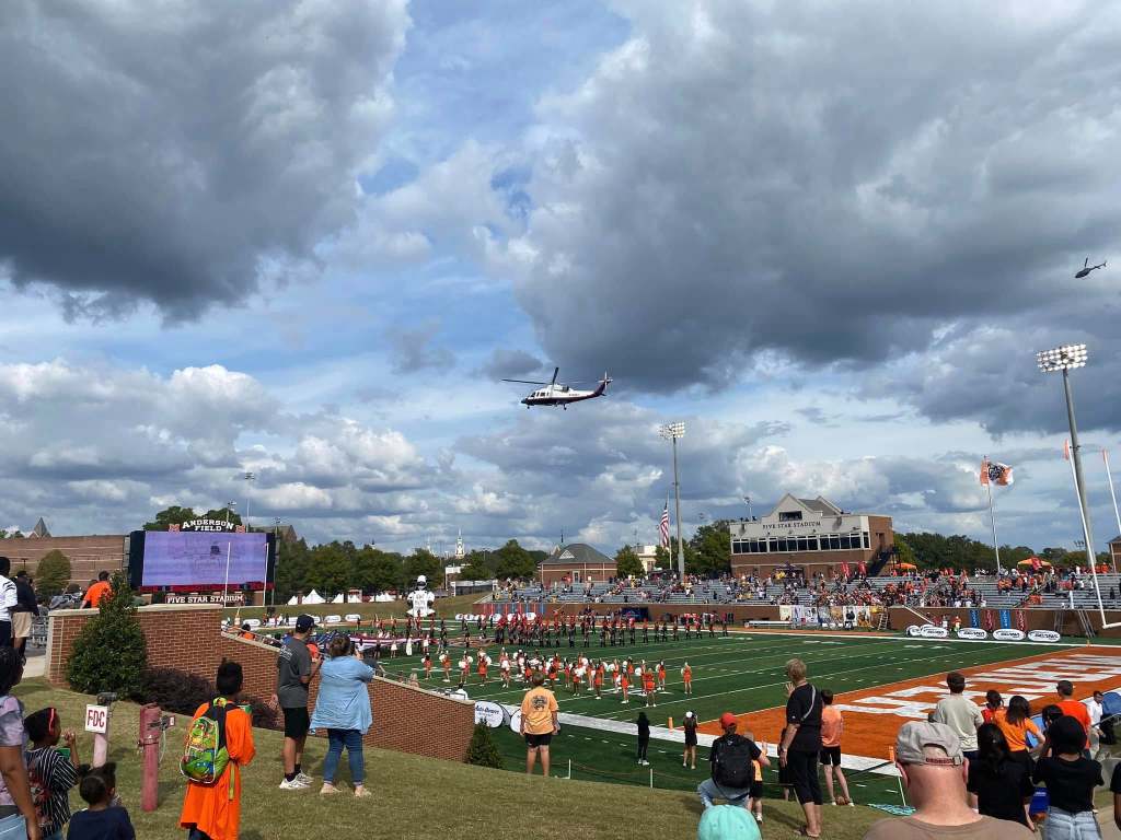 Helicopter flying over football stadium