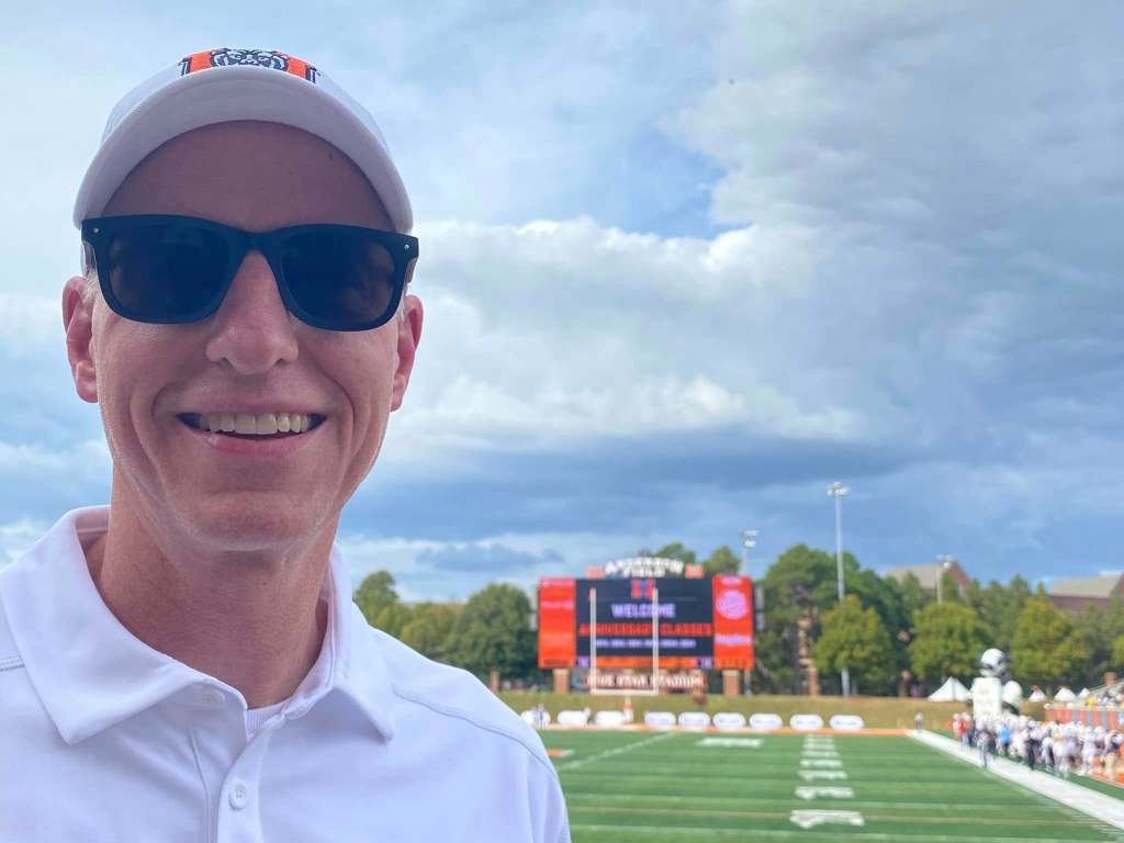 A man in a cap at Mercer University's football stadium