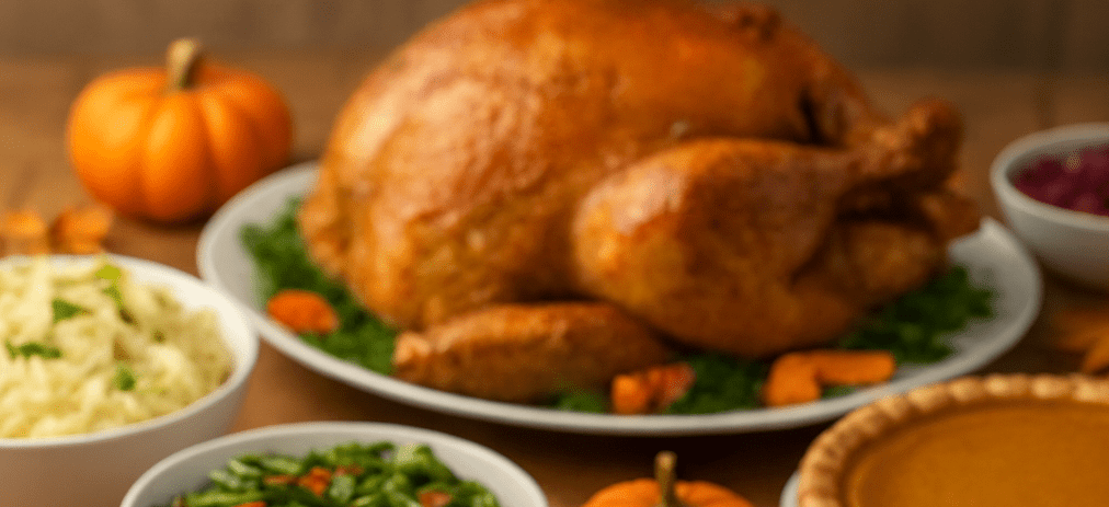 Thanksgiving table set with a turkey and side dishes