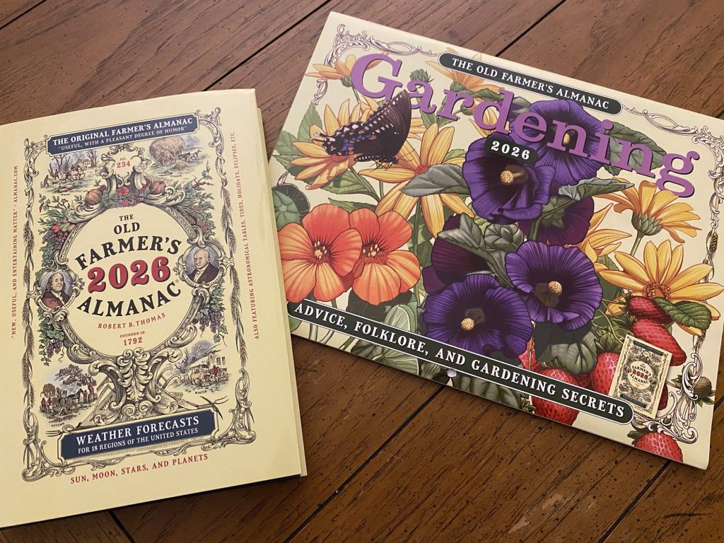 The Old Farmer's Almanac and gardening calendar on a table