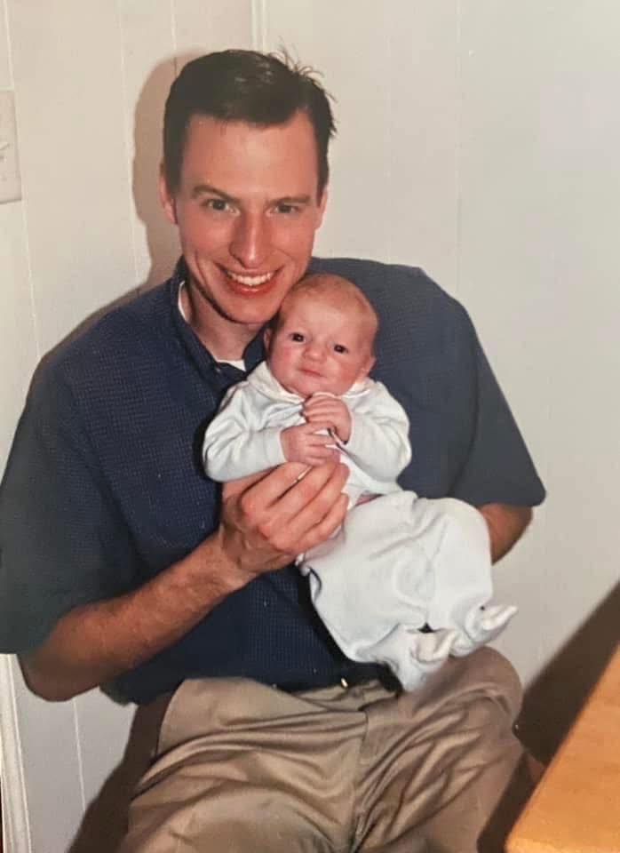 A man holds his baby son