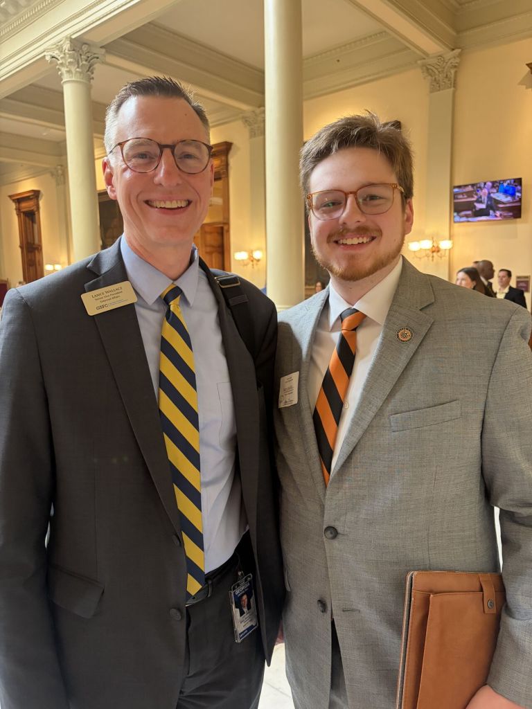 A father and son in suits and ties at the Georgia Capitol