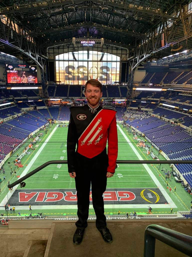 A marching band member in the Indianapolis dome before the national championship game