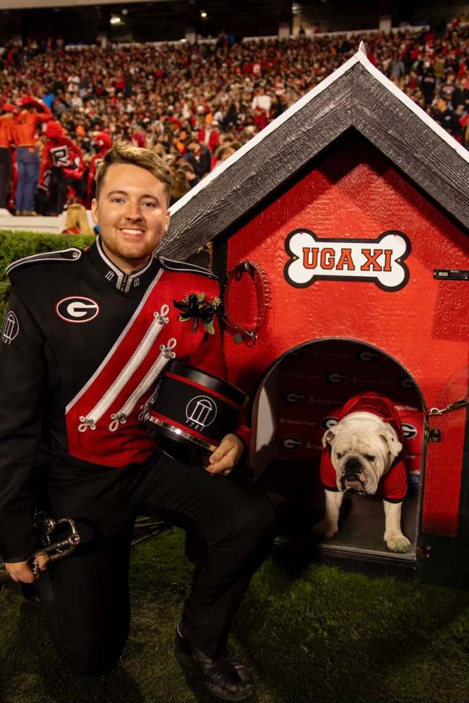 A Redcoat band member with Ugga the bulldog