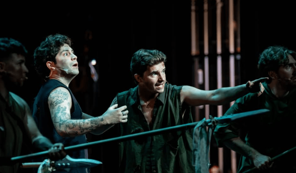 Actors with spears point off stage