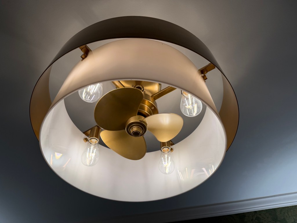 Overhead bathroom light with inset ceiling fan
