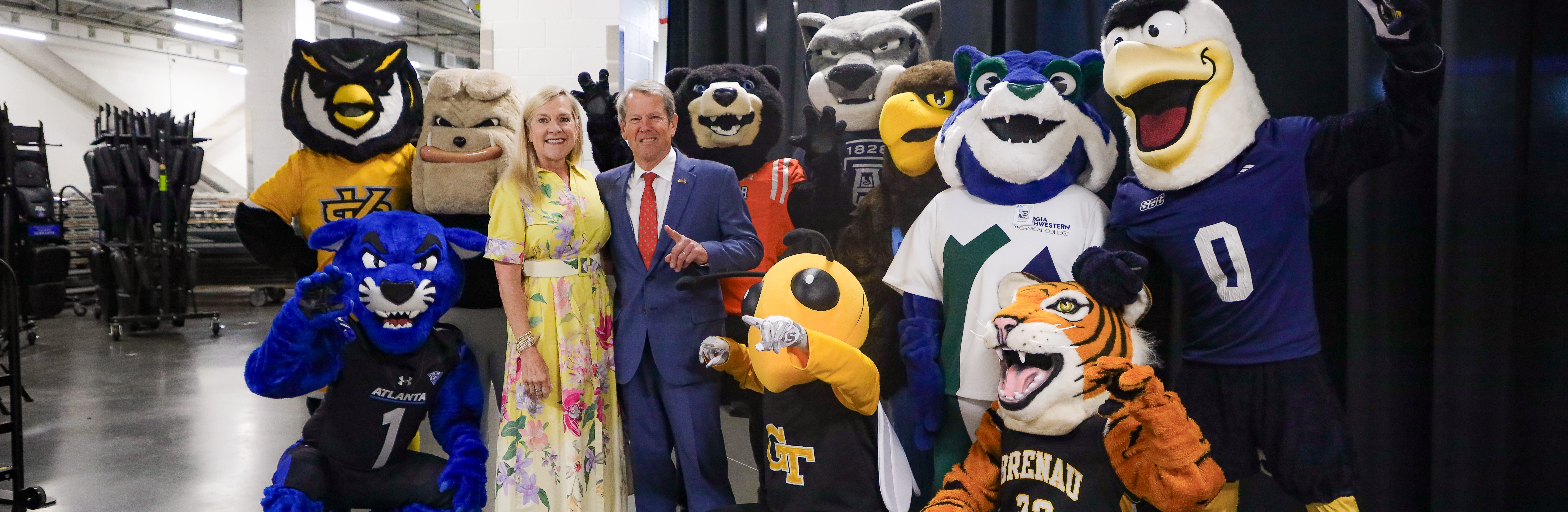 Georgia Governor Brian Kemp and First Lady Marty Kemp stand with mascots from Georgia colleges