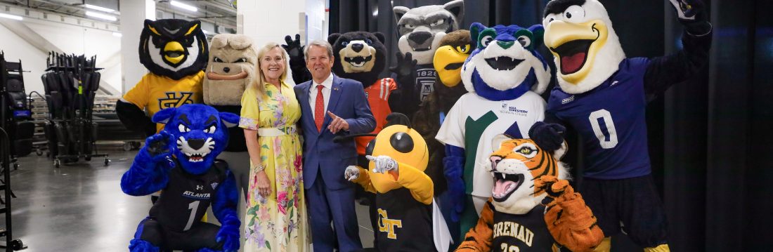 Georgia Governor Brian Kemp and First Lady Marty Kemp stand with mascots from Georgia colleges