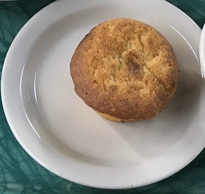 a small plate with a cornbread muffin